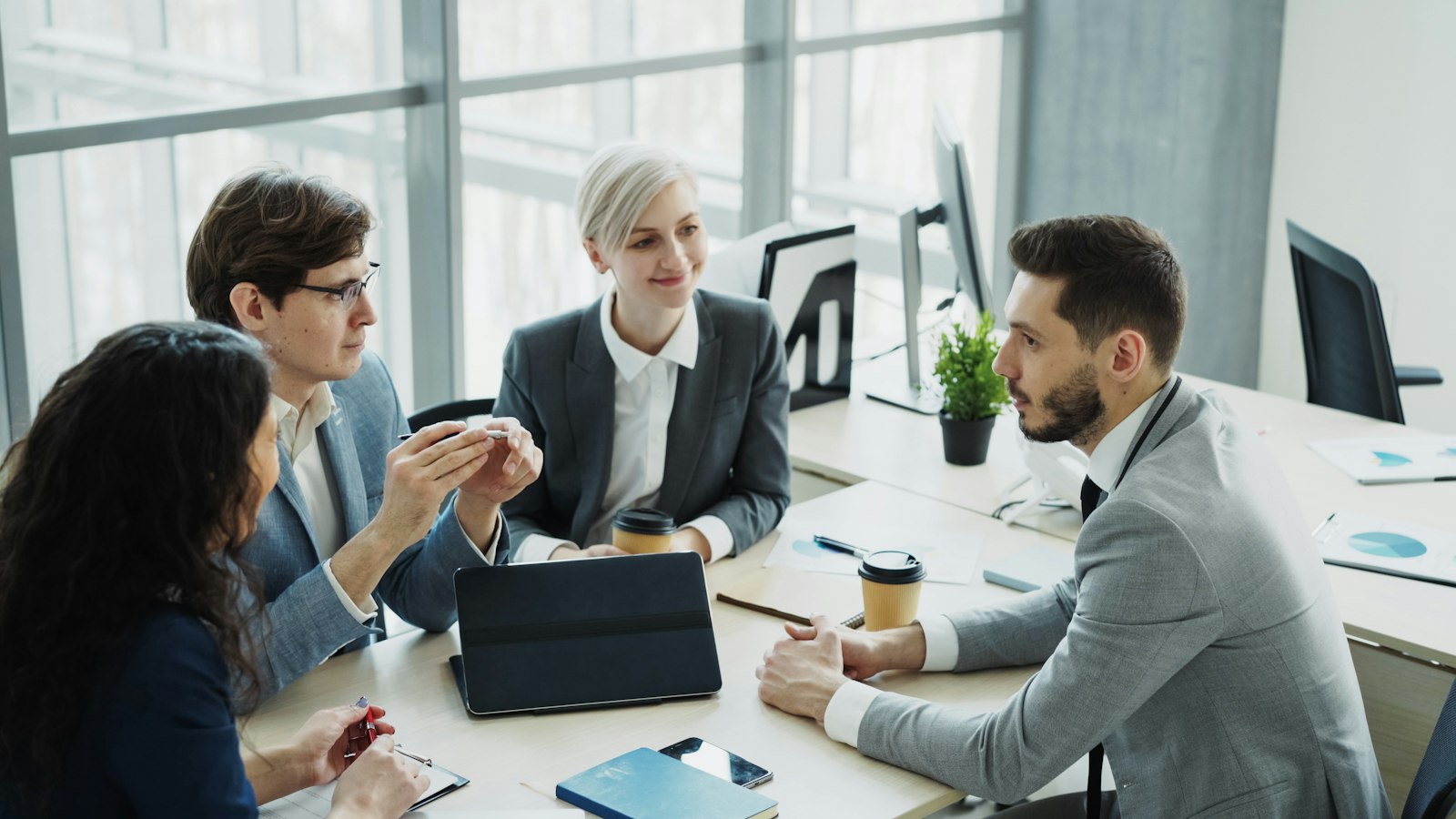 A diverse team of professionals collaborating around a table